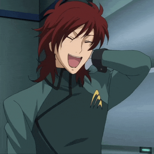a man with red hair is laughing and wearing a green shirt with the letter a on it