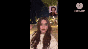 a woman is looking at a picture of a man on a video call .