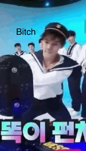 a man in a sailor costume is kneeling down in front of a group of men and a sign that says bitch .
