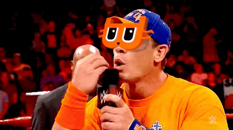 a wrestler wearing a mask and holding a microphone