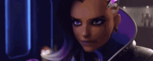 sombra is a female video game character from overwatch holding a purple object in her hand .
