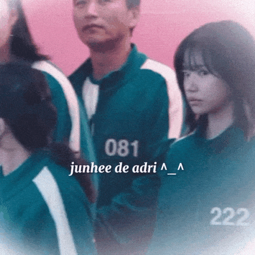 a group of people are standing next to each other and one of them has the number 222