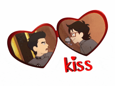 a couple of heart shaped mirrors with the word kiss below them