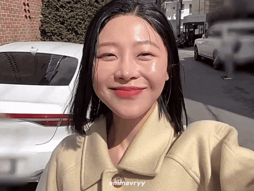 a woman taking a selfie with the name emmavrryy on her jacket