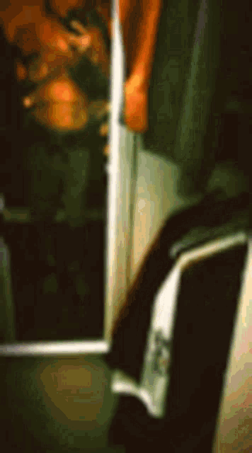 a blurry picture of a person taking a selfie in a mirror .