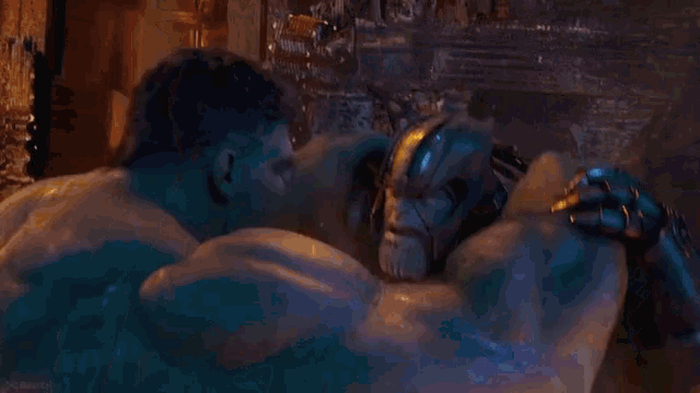 a close up of the hulk 's face and arms