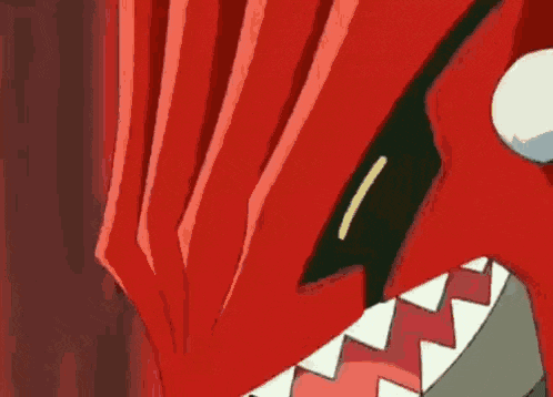 a close up of a cartoon character 's mouth with sharp teeth .