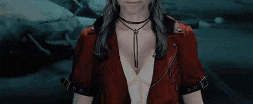 a woman in a red jacket is waving her hand in a video game scene .