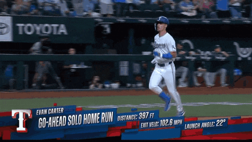 a baseball player named evan carter is running on a baseball field