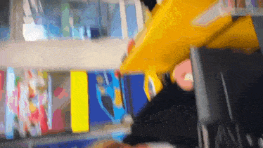a blurry picture of a person sitting at a counter