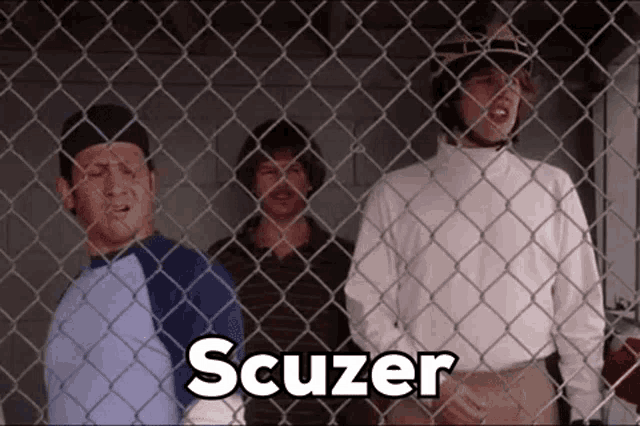 three men behind a chain link fence with scuzer written on the bottom right