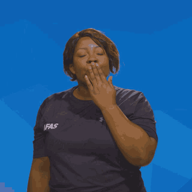 a woman wearing a shirt that says ifas on it