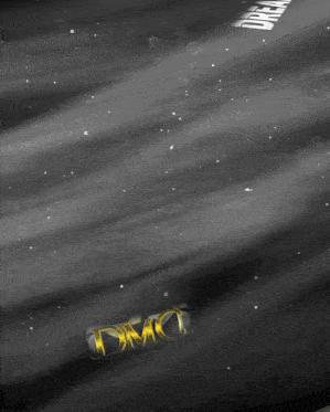 a black and white image of a dmc logo in the space