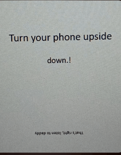 a card that says turn your phone upside down on it