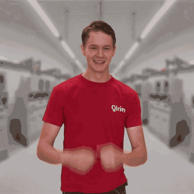 a man wearing a red shirt that says ' girien ' on the front