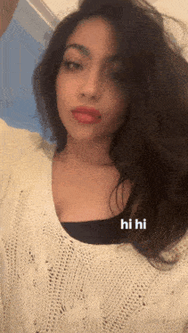 a woman in a white sweater is taking a selfie with the words hi hi below her