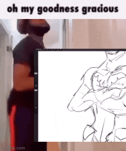 a man with a beard is standing next to a computer screen with a drawing of a man on it .