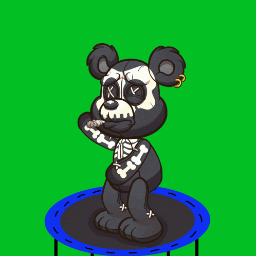 a black teddy bear is jumping on a trampoline