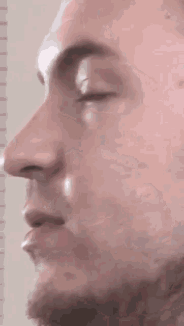 a close up of a man 's face and nose
