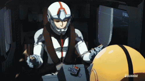 a man in a helmet is sitting next to a yellow helmet that says sunrise on the bottom
