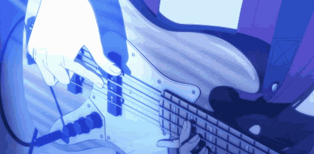 a person is playing a bass guitar in a blue background