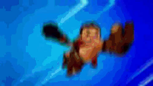 a cartoon character is flying through the air while holding a weapon .