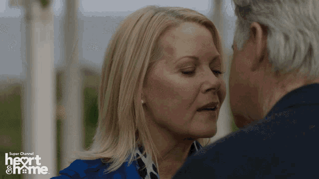 a woman kisses a man on the forehead in a super channel heart and home ad