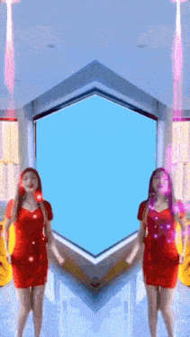 two women in red dresses are dancing in front of a blue window