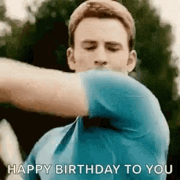 a man in a blue shirt is making a funny face and saying `` happy birthday to you '' .