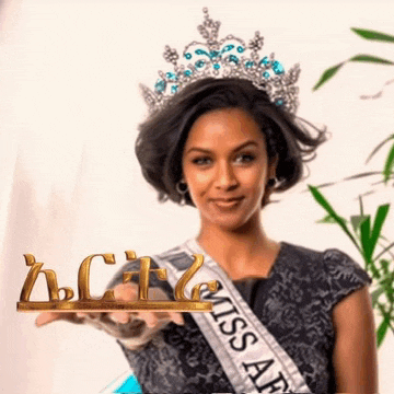 a woman wearing a crown and a miss africa sash
