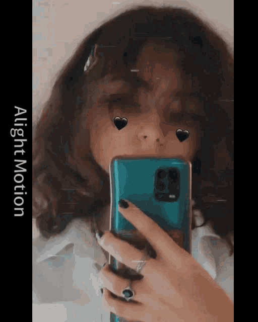 a girl is taking a picture of herself with hearts on her face and the words alight motion on the bottom