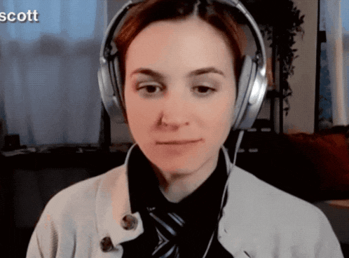 a woman wearing headphones with the name scott in the upper right corner