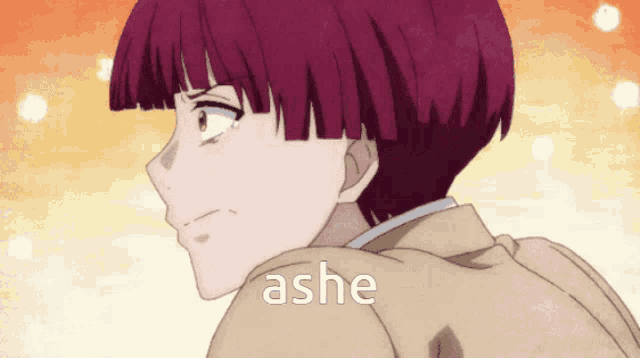 a close up of a person 's face with the word ashe below it