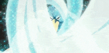 a blue bird with a yellow beak is surrounded by a swirl of ice .