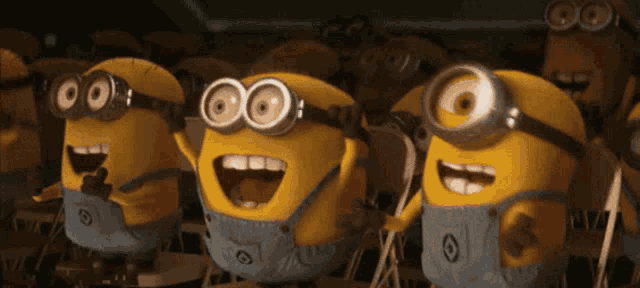 a group of minions wearing overalls and goggles are standing in a row