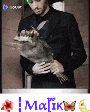 a man in a suit is holding a bouquet of flowers in front of a gocut ad