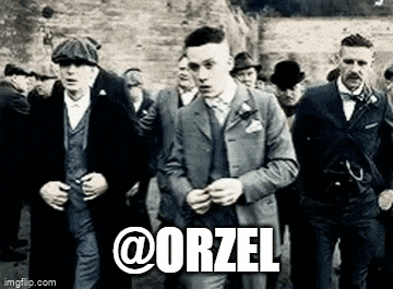 a group of men in suits and hats are walking down a street with the word orzel on the bottom .