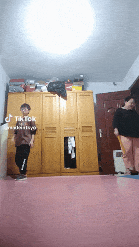 a tiktok video of a boy and a woman dancing in front of a closet