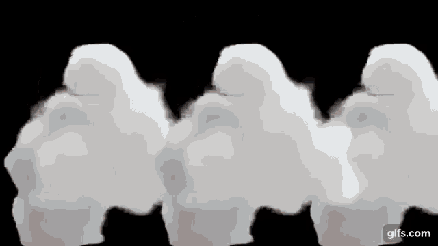 a row of white clouds floating in the sky on a black background .
