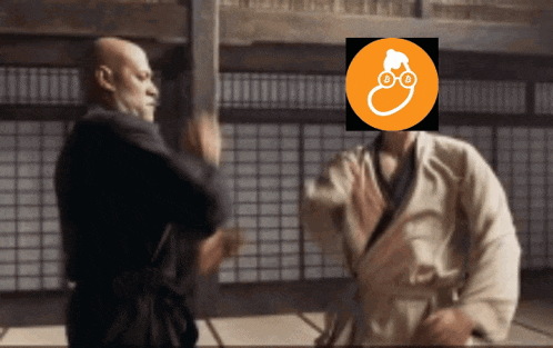 a man in a karate uniform is standing next to another man