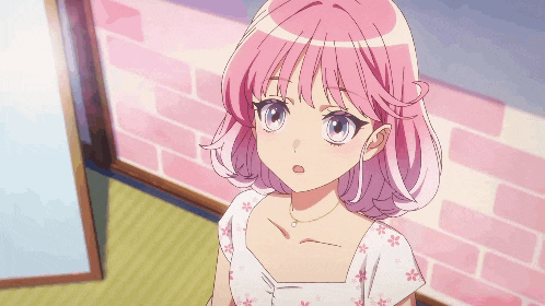a girl with pink hair is wearing a white shirt with flowers on it