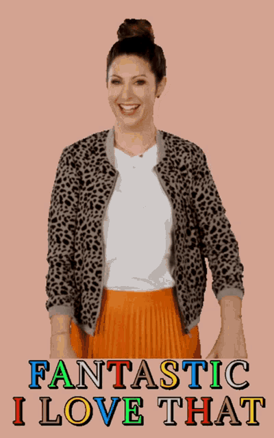 a woman wearing a leopard print jacket and an orange pleated skirt