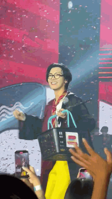 a man in a harry potter costume is holding a basket that says mcdonalds on it