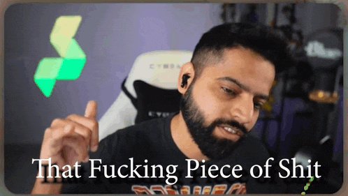 a man with a beard is pointing at something with the words that fucking piece of shit behind him