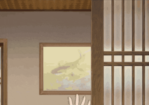 a room with a picture on the wall and a wooden sliding glass door