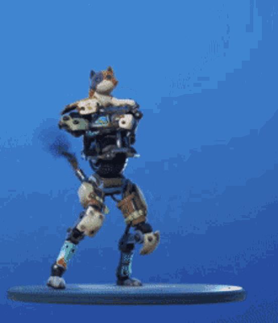 a robot with a cat on its back is standing on a blue surface