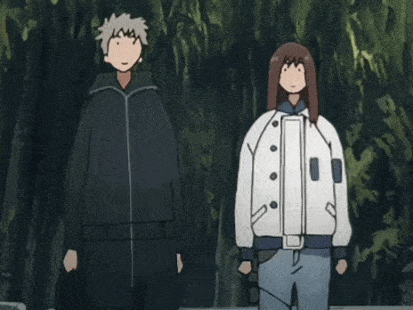 a man and a woman are standing next to each other .