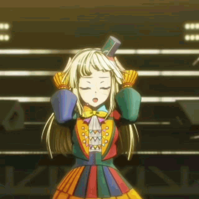 a girl in a colorful dress is standing on a stage with her eyes closed .