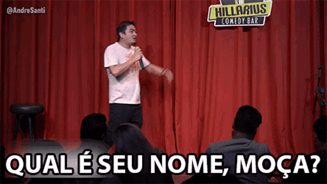 a man is giving a speech in front of a crowd at the hilarious comedy bar