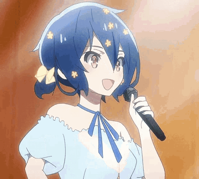 a girl with blue hair is holding a microphone and singing into it .
